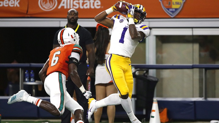 LSU wide receiver Ja'Marr Chase (1) catches a pass inside the 5-yard line as Miami defensive back Jhavonte Dean (6) defends during the first half of an NCAA college football game Sept. 2, 2018. 