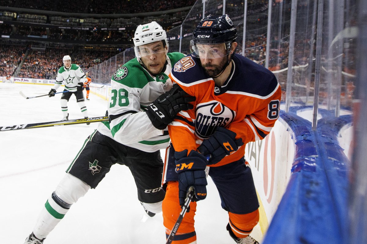 Dallas Stars' Joel L'Esperance (38) and Edmonton Oilers' Sam Gagner (89) battle for the puck during second period NHL action in Edmonton, Alta., on Thursday March 28, 2019. 
