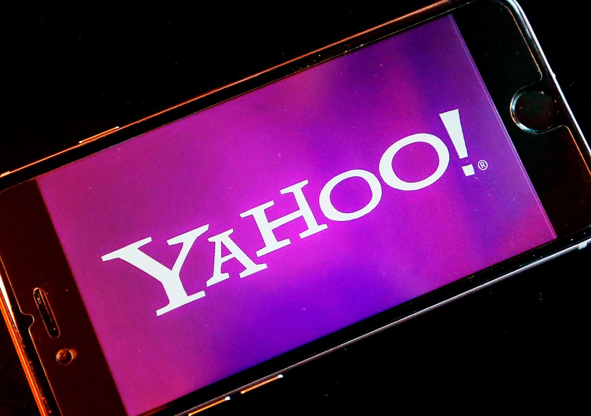 In this Dec. 15, 2016, file photo, the Yahoo logo appears on a smartphone in Frankfurt, Germany. 