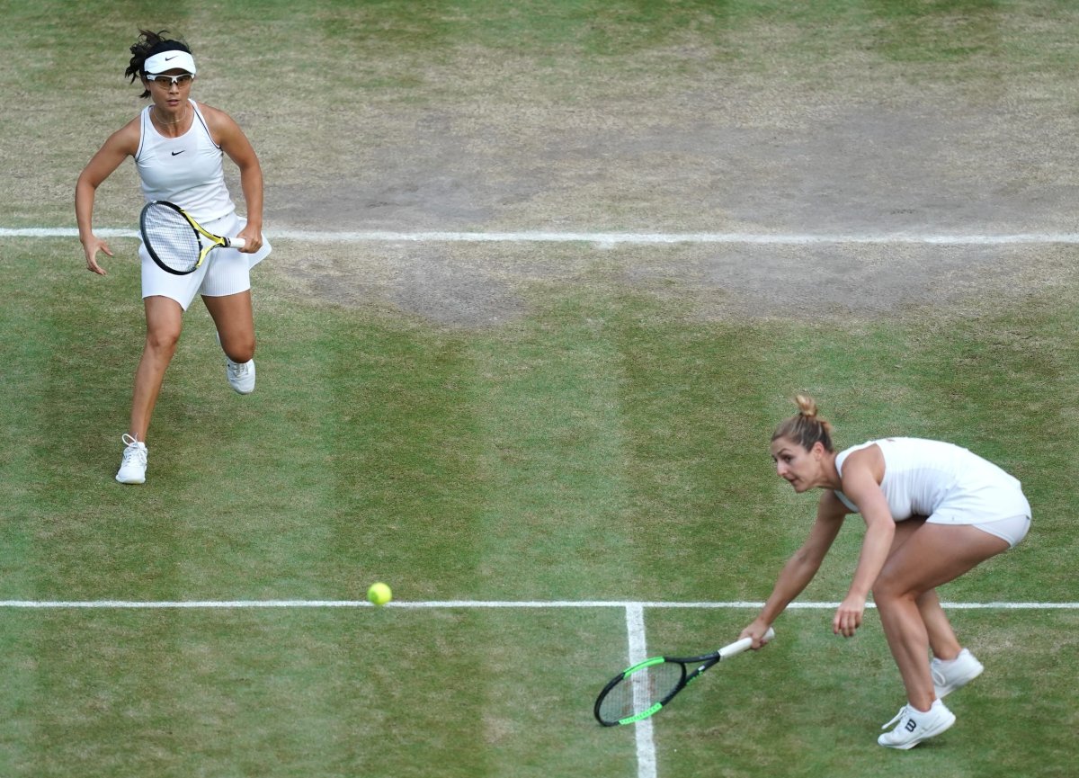 Gabriela Dabrowski of Canada and Yifan Xu of China in action against Su-Wei Hsieh of Taiwan and Barbora Strycova of Czech Republic during their Women's Doubles final match at the Wimbledon Championships at the All England Lawn Tennis Club, in London, Britain, 14 July 2019.