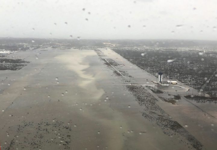 This Monday, Sept. 2, 2019 photo released by the U.S. Coast Guard Station Clearwater, shows flooding on the runway of the Marsh Harbour Airport in the Bahamas.