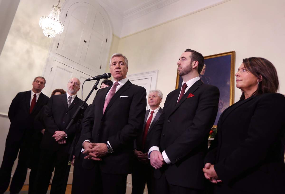 Newfoundland and Labrador Liberal Party Leader Dwight Ball, joined by members of his cabinet, Gerry Byrne, left to right, Perry Trimper, Eddie Joyce, Andrew Parsons and Siobahn Coady, speaks with the media after being sworn in as the province's 13th premier at Government House, in St. John's, N.L., on Monday, Dec. 14, 2015. Ball shuffled his cabinet in St. John's this morning, moving the former provincial Speaker to a cabinet position. 
