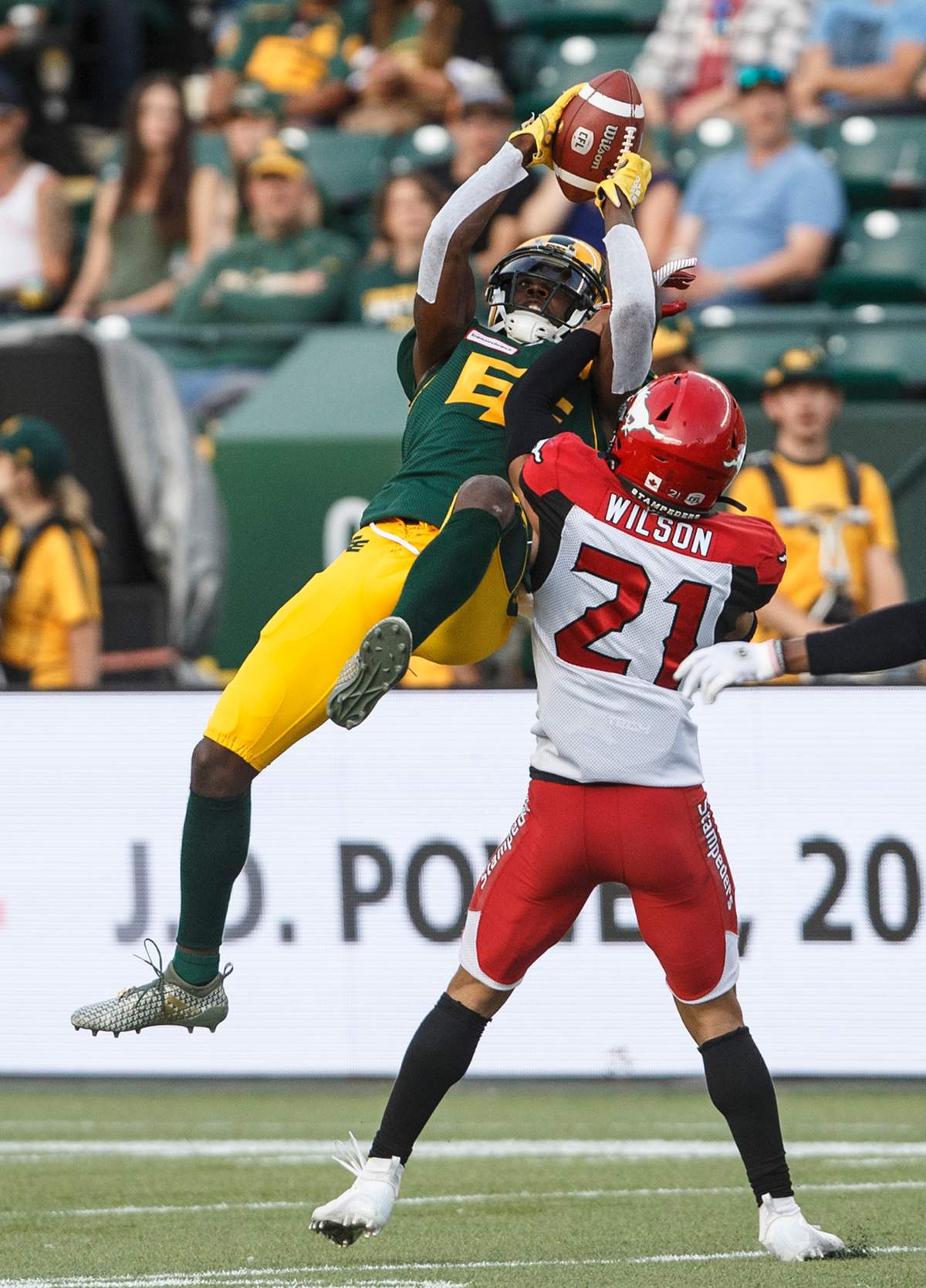 Calgary Stampeders' Raheem Wilson tries to stop Edmonton Eskimos' DaVaris Daniels (80) from making the catch during second half CFL action in Edmonton, Alta., on Saturday September 7, 2019. 