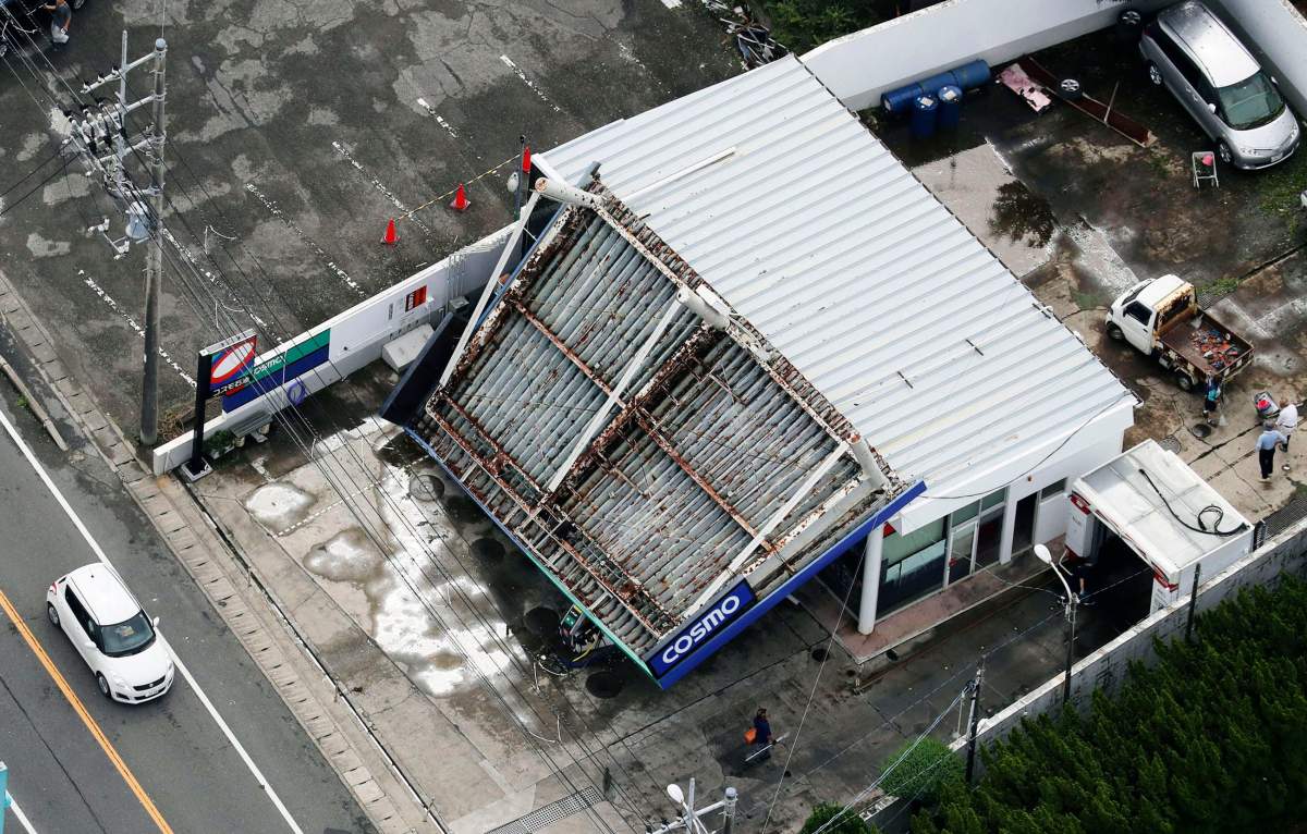 The rooftop of a gas station is collapsed after typhoon hit the area in Tateyama, south of Tokyo, Monday, Sept. 9, 2019.