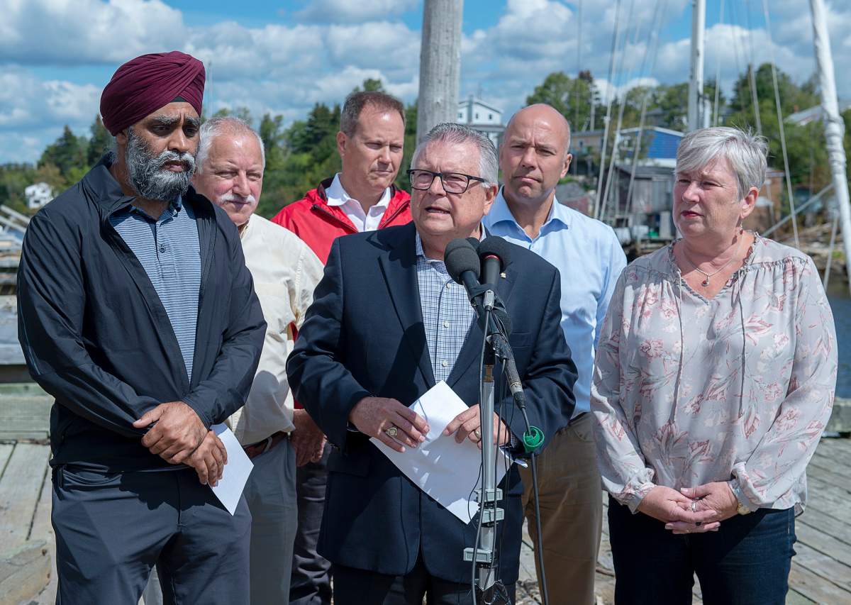 Harjit Sajjan, minister of National Defence, , left to right, Darrell Samson, MP for Sackville-Preston-Chezzetcook, Darren Fisher, MP for Dartmouth-Cole Harbour, Ralph Goodale, minister of Public Safety and Emergency Preparedness, Andy Filmore, MP for Halifax and Bernadette Jordan, minister of Rural Economic Development talk to reporters in Herring Cove, N.S. on Tuesday, Sept. 10, 2019.