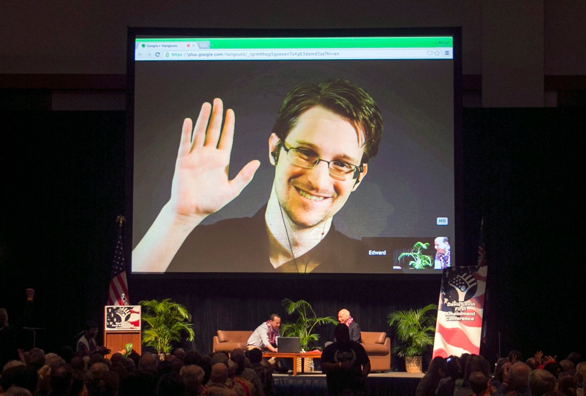 FILE - In this Feb. 14, 2015, file photo, Edward Snowden appears on a live video feed broadcast from Moscow at an event sponsored by ACLU Hawaii in Honolulu.