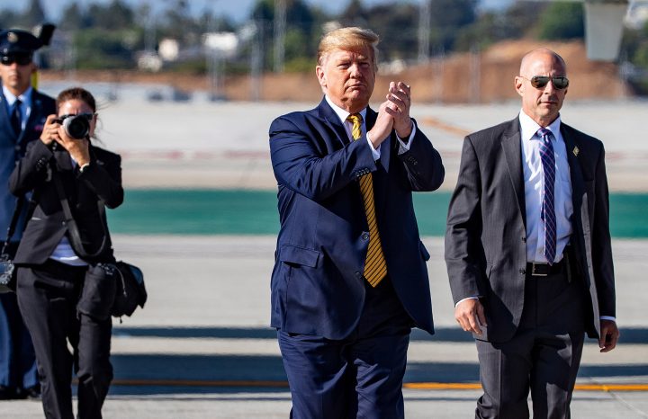 President Donald Trump walks toward supporters after arriving at Los Angeles International Airport on Air Force One, Tuesday, Sept. 17, 2019, in Los Angeles. 