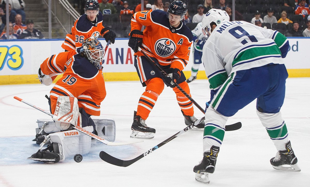 Vancouver Canucks' J.T. Miller (9) is stopped by Edmonton Oilers' goalie Mikko Koskinen (19) during first period NHL preseason action in Edmonton, Alta., on Thursday September 19, 2019. 