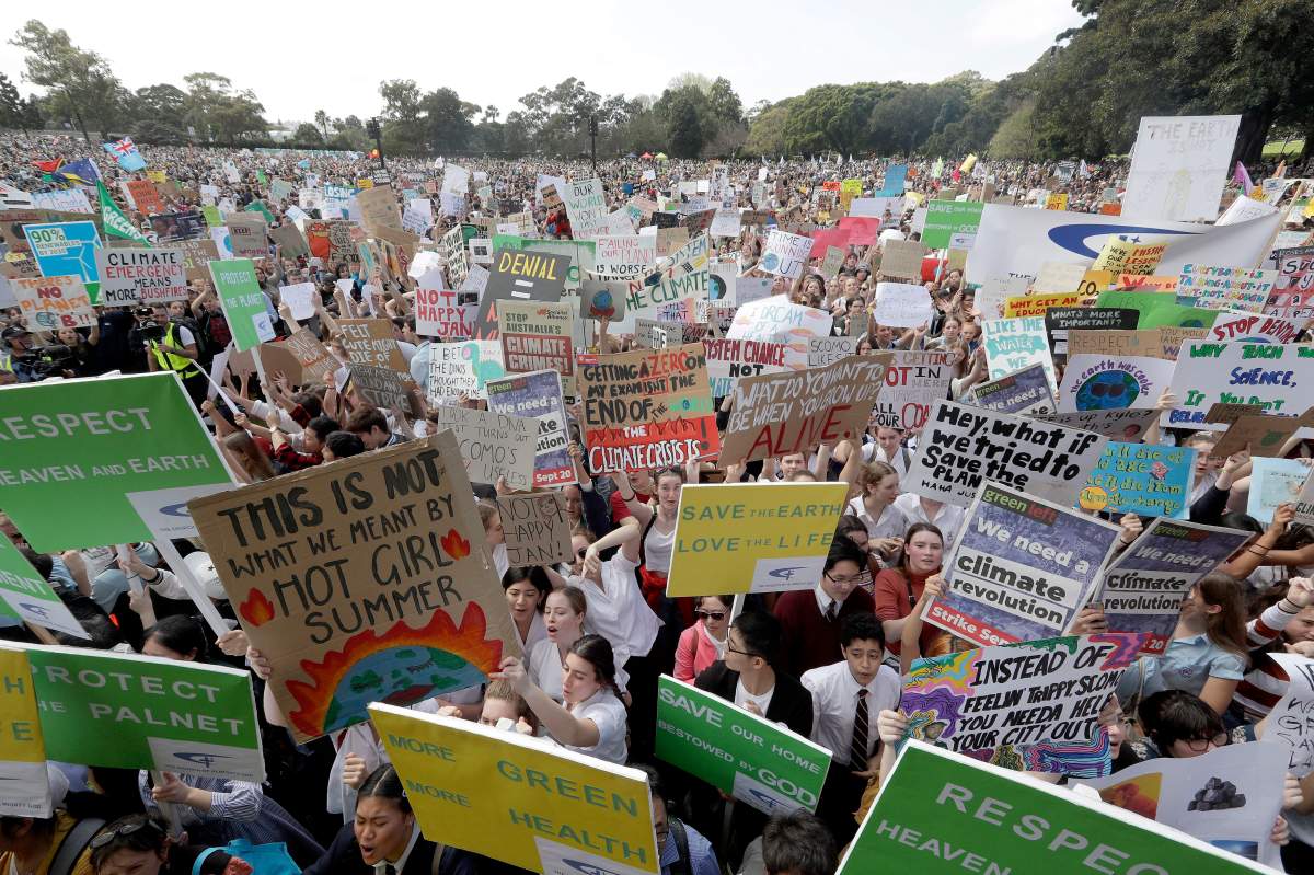 Thousands of protestors gather in Sydney, calling for action to guard against climate change. (AP Photo/Rick Rycroft)