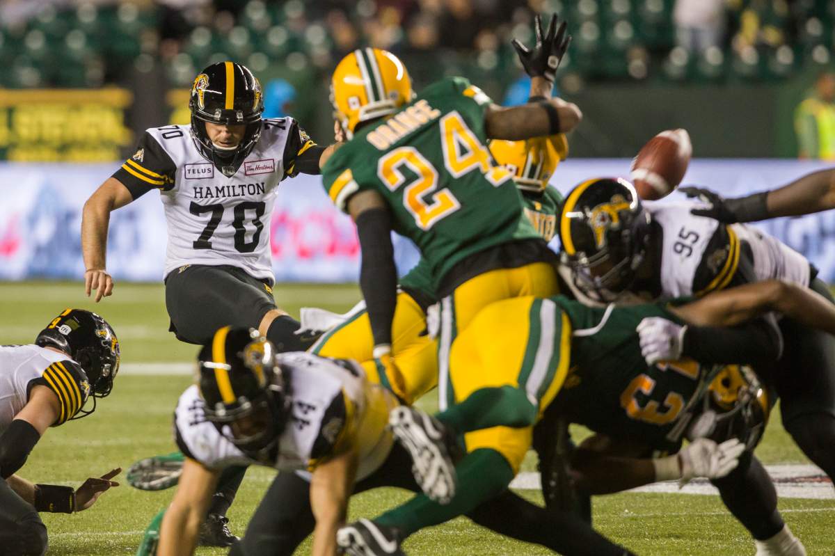 Hamilton Tiger-Cats kicker Lirim Hajrullahu (70) kicks a field goal to win the game against the Edmonton Eskimos during second half CFL action in Edmonton, Alta., on Friday September 20, 2019. The Tiger-Cats won 30-27.