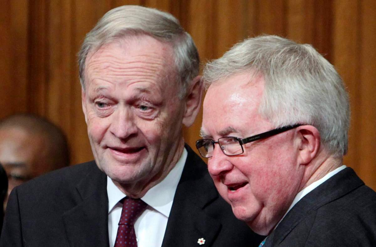Former prime ministers Jean Chretien and Joe Clark chat following the installation ceremony David Johnston as Canada's 28th Governor General in the Senate on Parliament Hill, Friday, Oct. 1, 2010, in Ottawa.