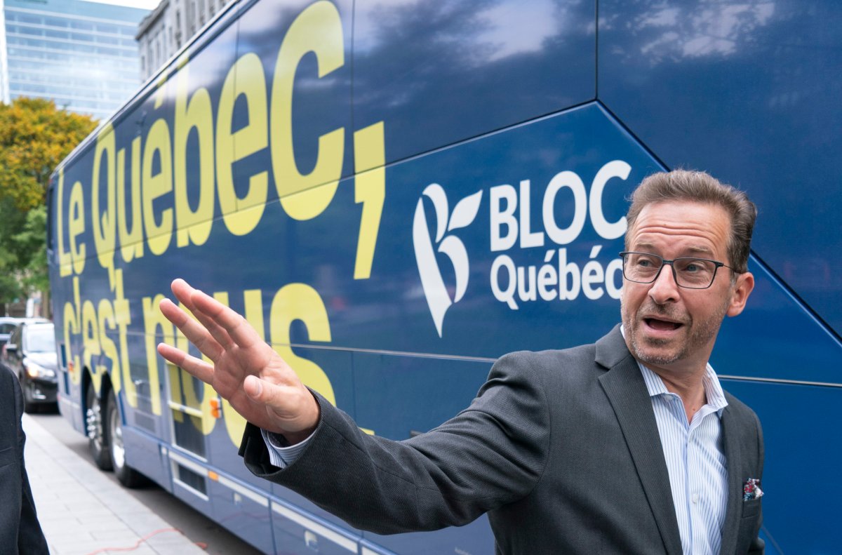Bloc Quebecois Leader Yves-Francois Blanchet wavs as he boards his campaign bus following an announcement in Montreal, on Tuesday, September 24, 2019.