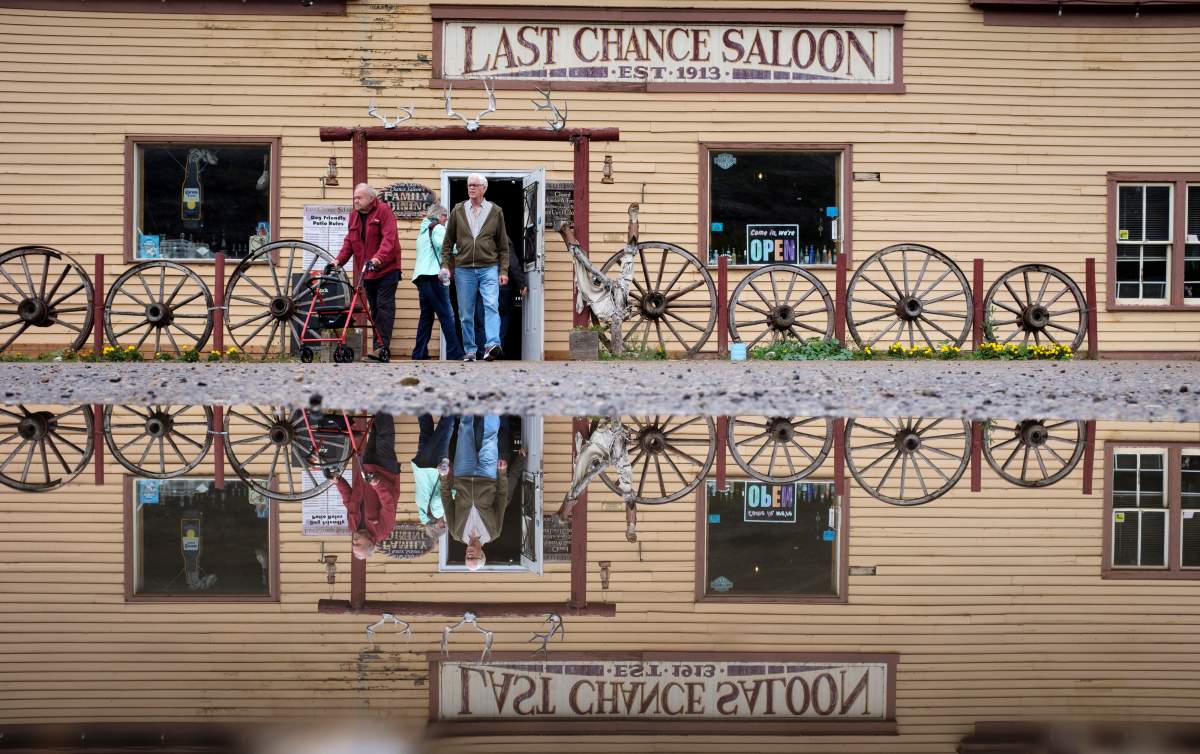 Patrons exit the historic and colourful Last Chance Saloon in the ghost town of Wayne near Drumheller, Alta., Thursday, Sept. 19, 2019.