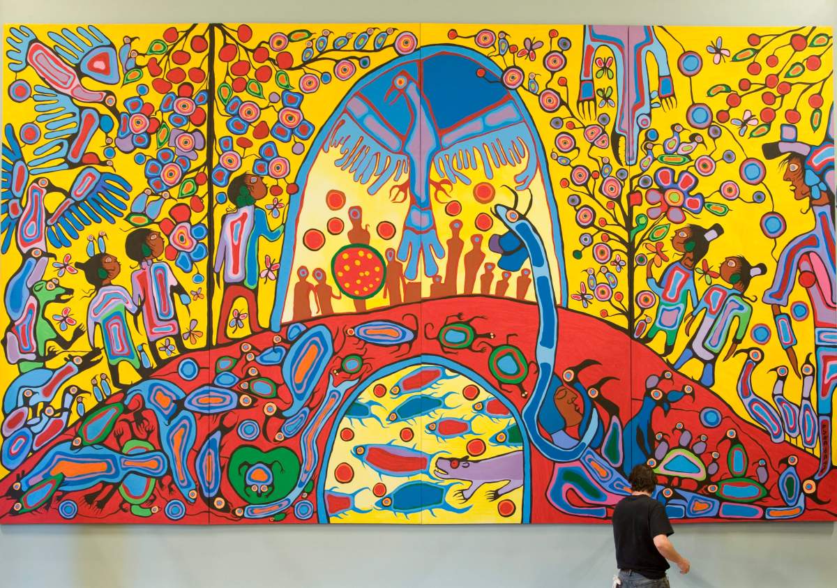 A worker installs Canadian Aboriginal artist Norval Morrisseau’s painting ‘Androgyny’ in the ballroom at Rideau Hall Thursday, Sept. 18, 2008 in Ottawa.