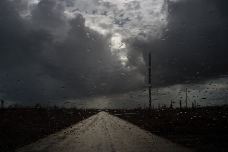 Rain drops cover a car's window shield prior to the arrival of a new tropical depression, that turned into Tropical Storm Humberto, in the aftermath of Hurricane Dorian en route to Mclean's Town, Grand Bahama, Bahamas, Friday Sept. 13, 2019. Humberto narrowly missed the island over the weekend.