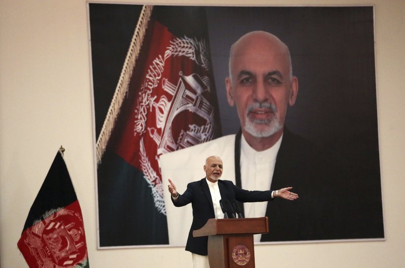 FILE - In this Sept. 9, 2019, file photo, Afghan President Ashraf Ghani speaks during a ceremony to introduce the new chief of the intelligence service, in Kabul, Afghanistan. President Donald Trump's halt to U.S.-Taliban talks looks like a gift to the beleaguered Afghan president, who has insisted on holding a key election in less than three weeks’ time despite widespread expectations that a peace deal would push it aside. 