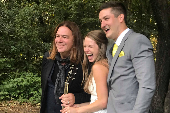 Canadian singer Alan Doyle, left, is shown with newlyweds Dana McKinlay and Stewart Dowd at their wedding in P.E.I.