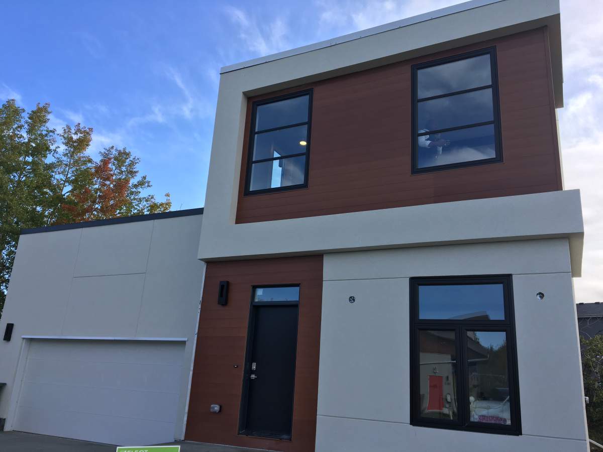 Family home made of shipping containers in Rocky Ridge.