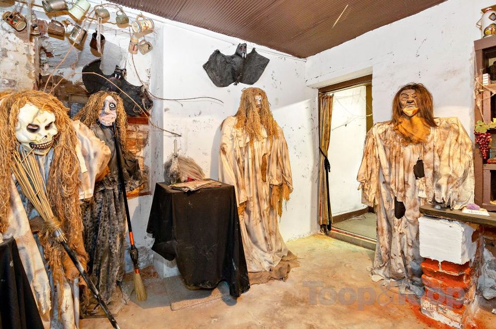 Several ghoulish figures are shown inside the Woodforde House in South Australia in this image from a real estate listing.