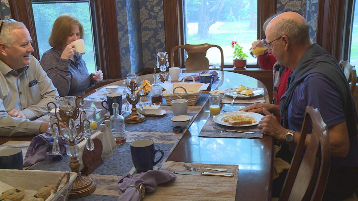 Guests enjoy breakfast at By the River B&B
