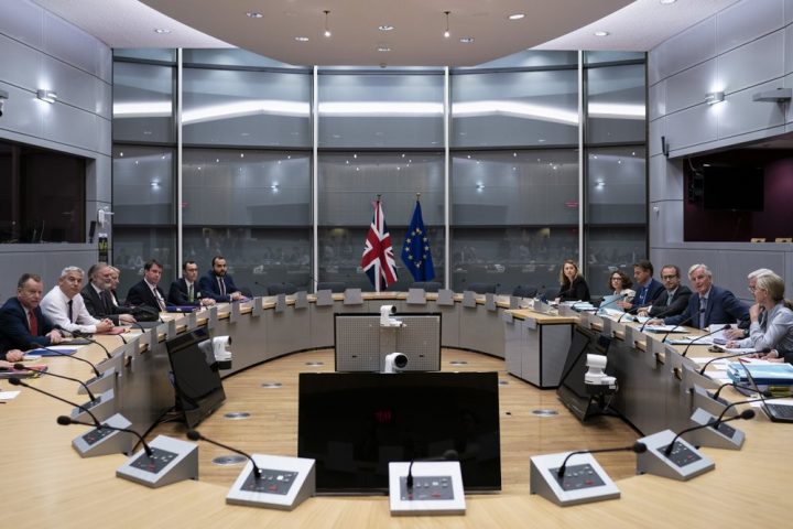 Britain's Brexit Secretary Stephen Barclay, second left, sits along with his team during a meeting with European Union chief Brexit negotiator Michel Barnier, second right, at the European Commission headquarters in Brussels, Friday, Sept. 20, 2019.