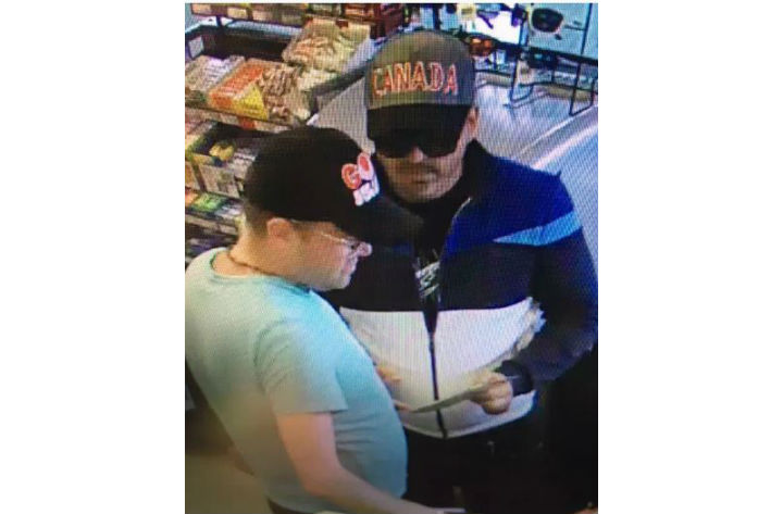 Barrie police are searching for two male suspects after  a man's credit cards were reportedly used fraudulently.