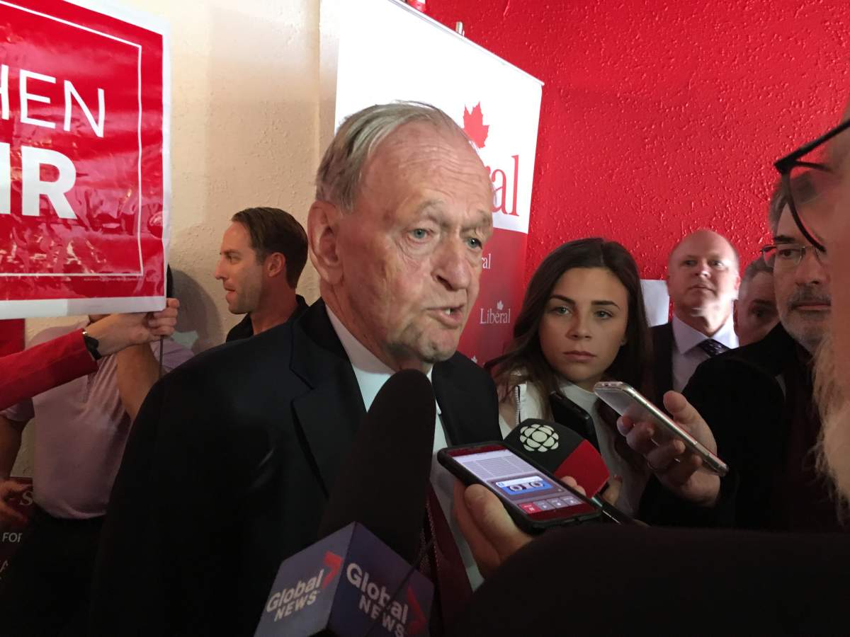Former Prime Minister Jean Chretien is interviewed by a throng of reporters at Stephen Fuhr’s campaign office Friday morning.
