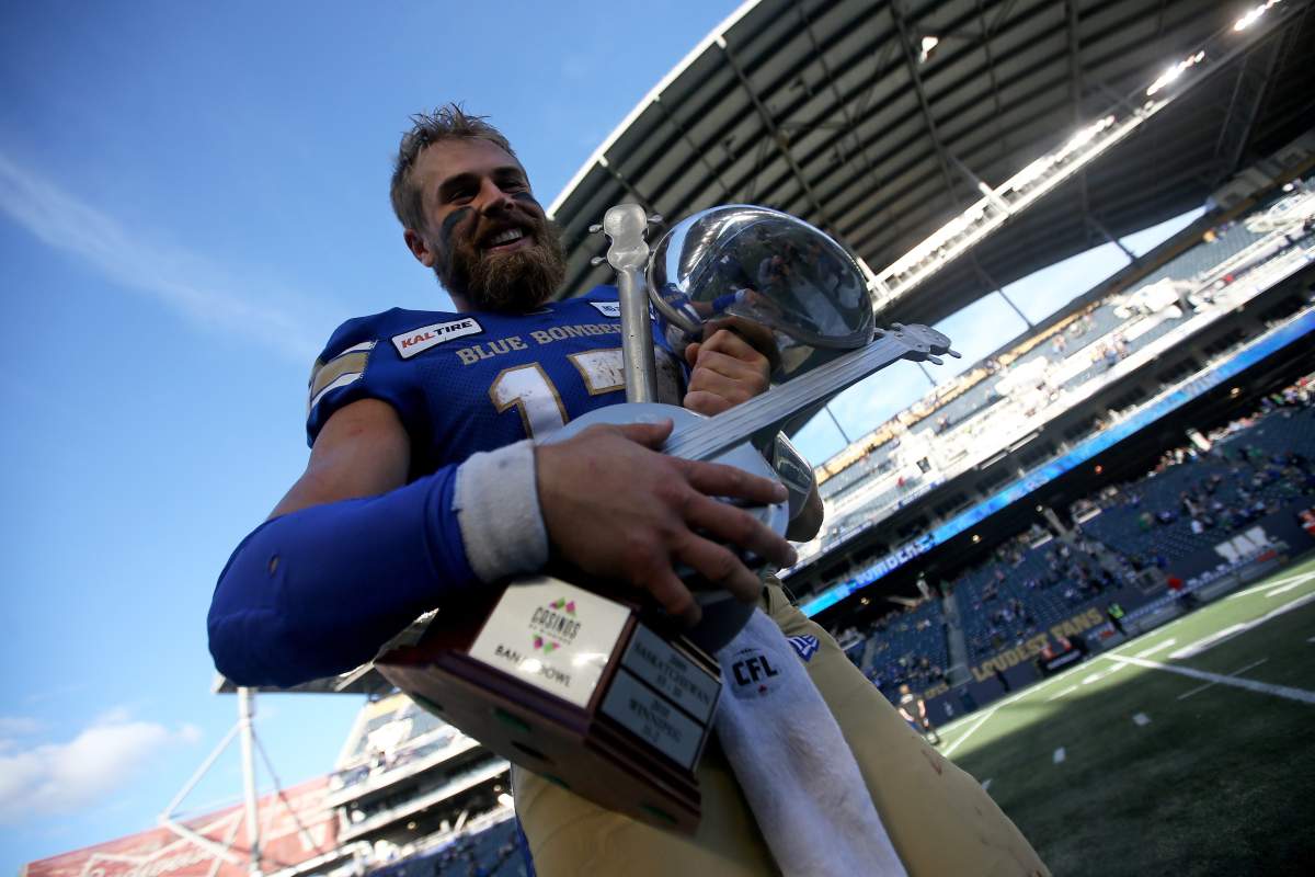 Winnipeg Blue Bombers' quarterback Chris Streveler (17) with the Banjo Bowl trophy after defeating the Saskatchewan Roughriders' during CFL action in Winnipeg on Saturday, September 7, 2019.  (CFL PHOTO - TREVOR HAGAN).
