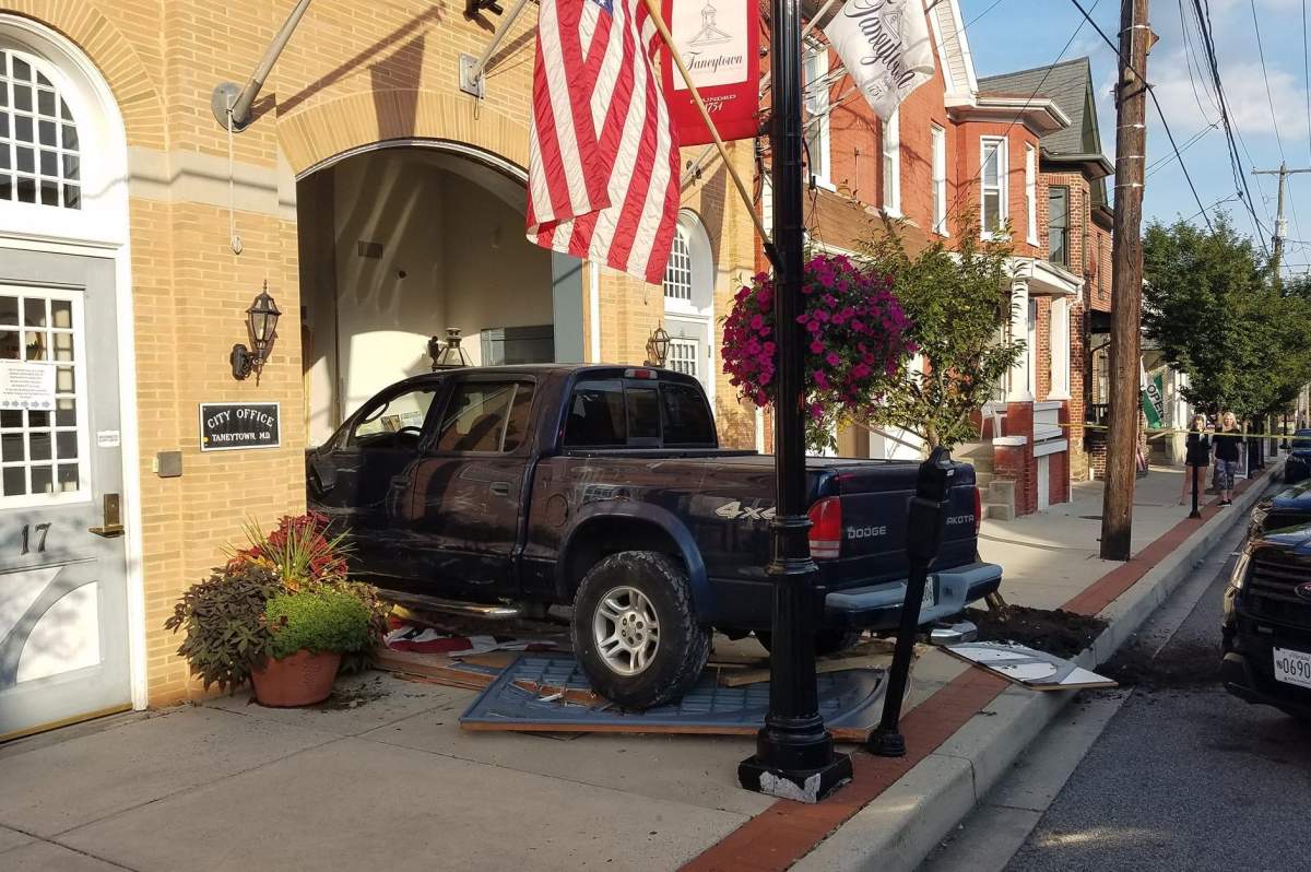 A pickup truck is shown after crashing into city hall in Taneytown, Md., on Aug. 30, 2019.