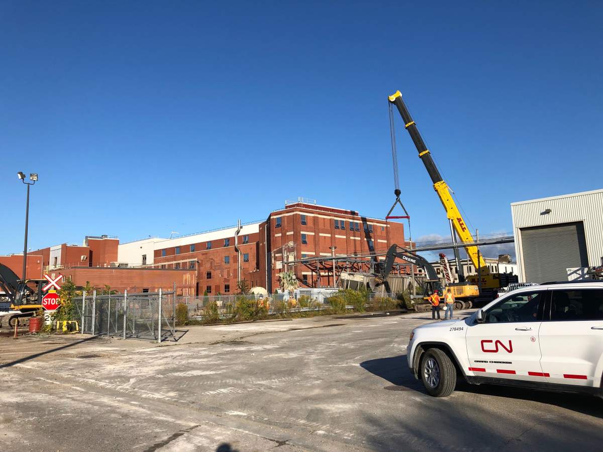 CN Rail crews deal with derailed cars on a section of tracks between Dundas Street and Florence Street on Tuesday morning.