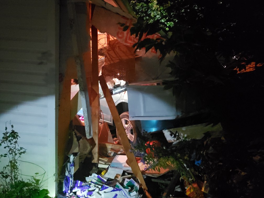 An SUV crashed into an attached garage at a home on Dale Road in Hamilton Township early Sunday.