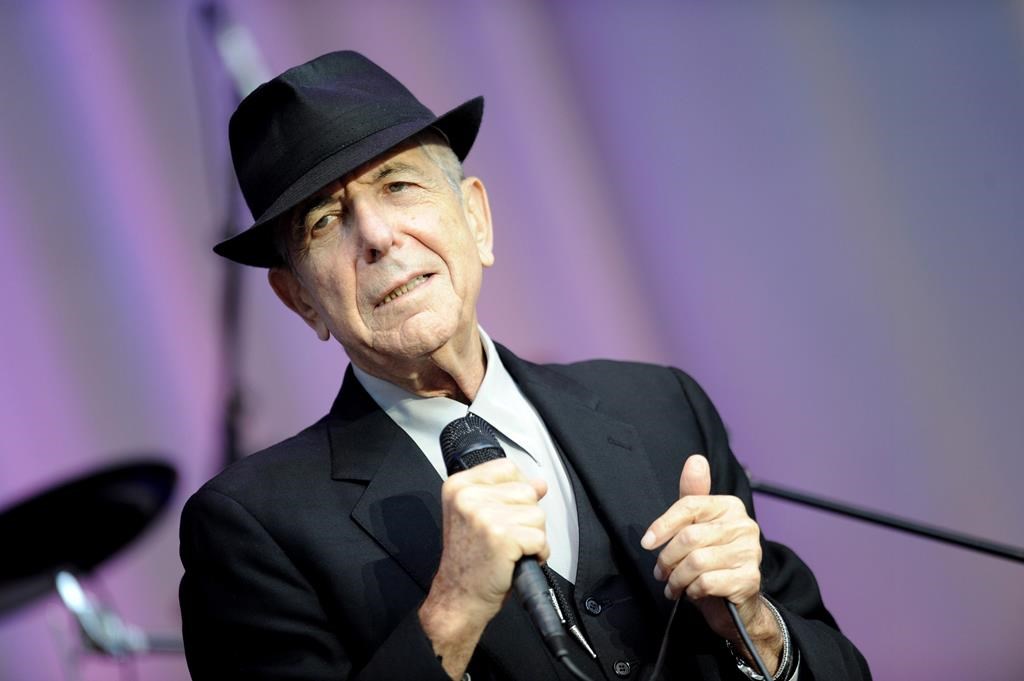 In this Aug. 18, 2010 file photo, singer Leonard Cohen performs open air at the Waldbuehne in Berlin.