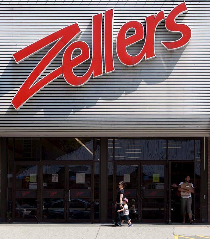 Customers leave a Zellers store in Lynn Valley in North Vancouver, B.C., Thursday, July, 26, 2012.