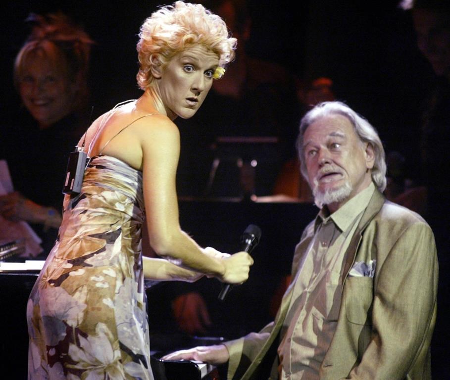 Singer songwriter Celine Dion jokes around with jazz pianist Vic Vogel at a gala event honouring songwriter Eddy Marnay, in Gatineau, Que., Wedneday, July 9, 2003. Vogel, who began playing the piano by ear at the age of five and rose to become one of Canada's jazz stalwarts, has died. He was 84.