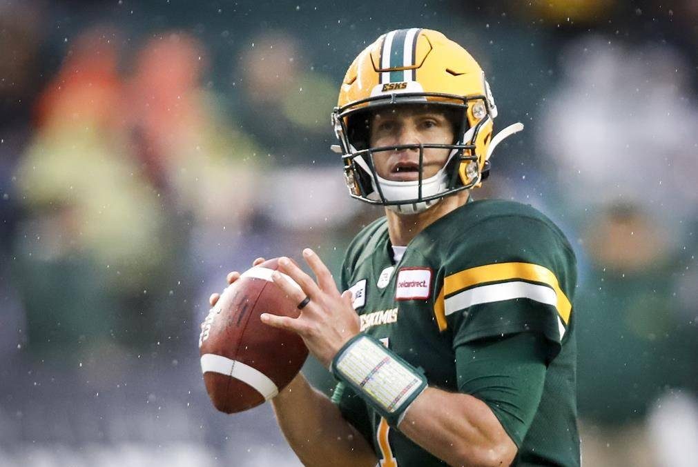 Edmonton Eskimos quarterback Trevor Harris looks for a receiver during first half CFL football action against the Winnipeg Blue Bombers in Edmonton, Friday, Aug. 23, 2019.