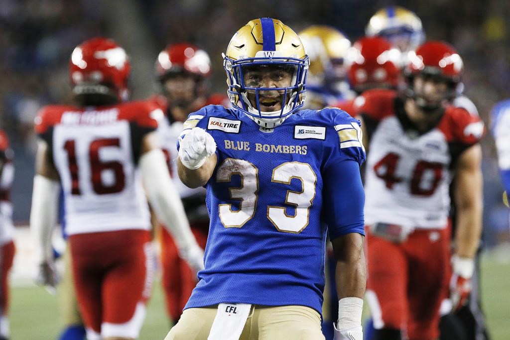 Winnipeg Blue Bombers' Andrew Harris (33) celebrates his run deep in the Calgary Stampeders' zone during the second half of CFL action in Winnipeg Thursday, August 8, 2019. THE CANADIAN PRESS/John Woods.