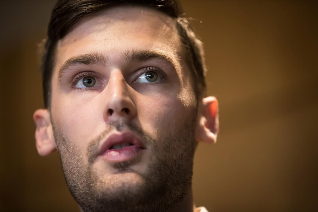 Port Moody Mayor Rob Vagramov speaks during a news conference at City Hall in Port Moody, B.C., on Thursday March 28, 2019. A mayor who stepped aside after he was charged with sexual assault has returned to work in Port Moody, B.C. THE CANADIAN PRESS/Darryl Dyck.