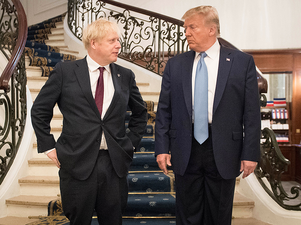 U.S. President Donald Trump (R) and British Prime Minister Boris Johnson arrive for a bilateral meeting during the G7 summit on Aug. 25, 2019 in Biarritz, France.