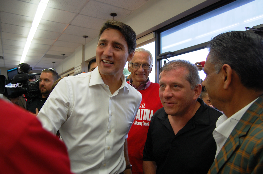 Liberal Leader Justin Trudeau visited a family-owned bakery and deli in Stoney Creek and posed with one of the owners on Monday.