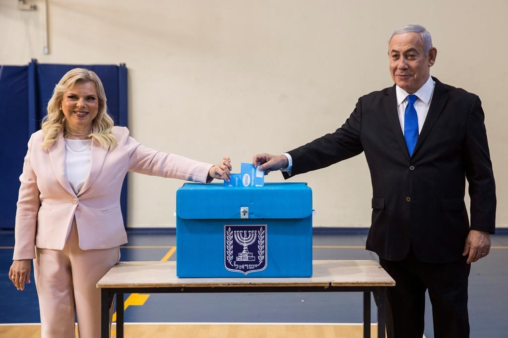 Israeli Prime Minister Benjamin and his wife Sarah casts their votes at a voting station in Jerusalem on September 17, 2019. Israelis began voting Tuesday in an unprecedented repeat election that will decide whether longtime Prime Minister Benjamin Netanyahu stays in power despite a looming indictment on corruption charges.