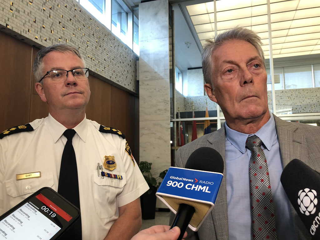 Hamilton Police Chief Eric Girt and Hamilton Mayor Fred Eisenberger speak with media following after a police services board meeting on June 17, 2019.