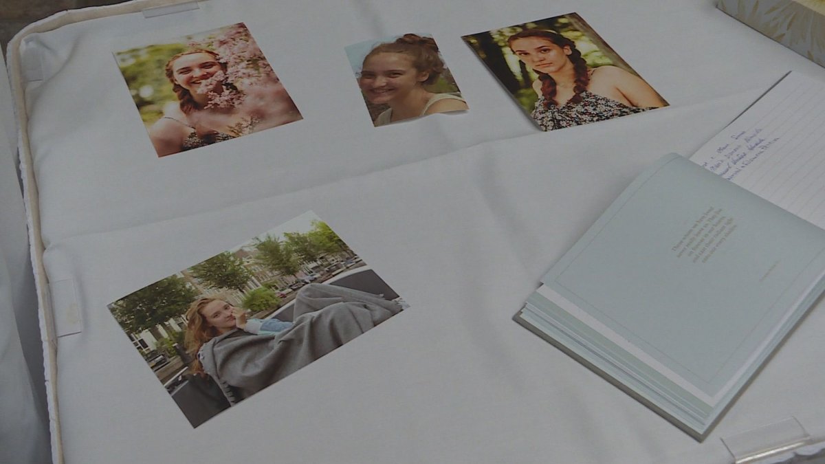 Photos of Emma Machado are laid out at her celebration of life in Winnipeg on Sunday, Sept. 22, 2019. 