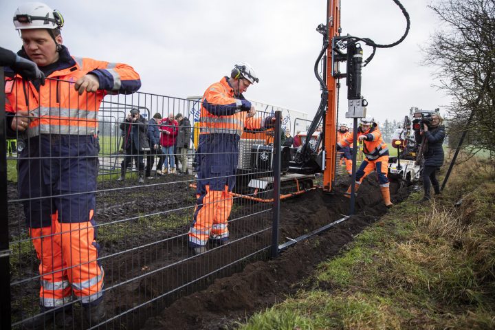 Workers start to set up the wild boar fence along the Danish-German border at Padborg, Denmark, Jan. 28, 2019.