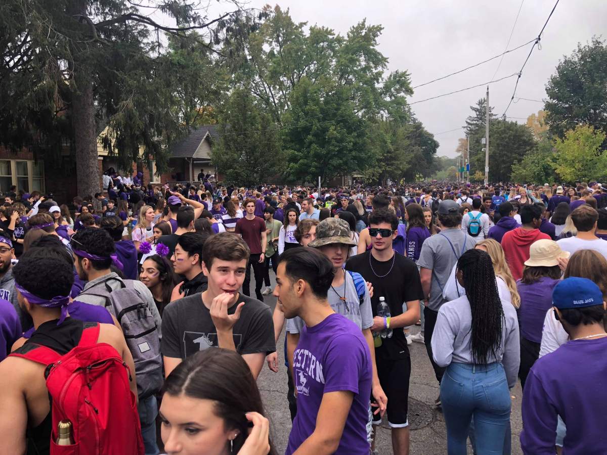 Thousands of students and partiers gather along Broughdale Avenue to celebrate 2019's unsanctioned Fake Homecoming (FOCO).