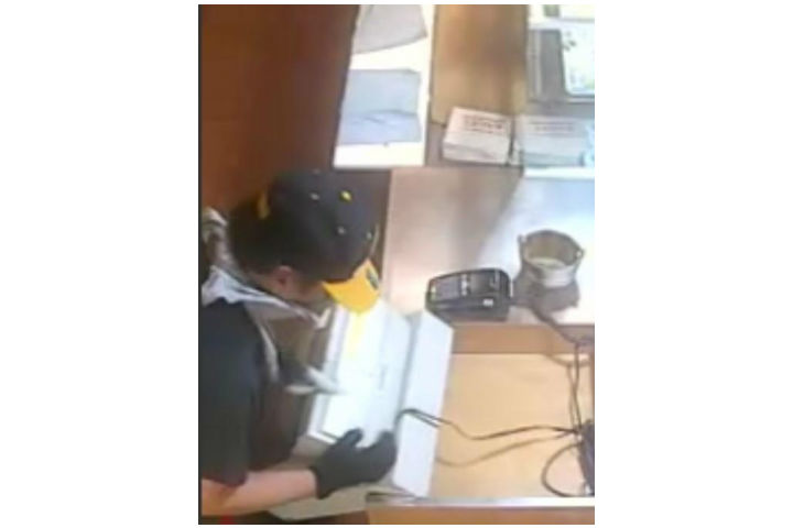 From the surveillance video that was acquired, police are describing the suspect to be five-foot-nine in height, wearing black pants, a grey shirt with a red stripe under the arm, black gloves, and a blue and yellow baseball hat.