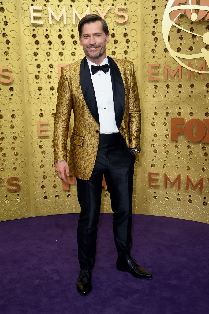 Nikolaj Coster-Waldau wore a mustard-yellow sport coat and black satin pants.
