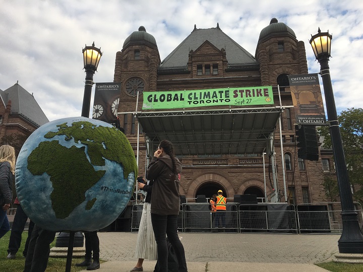 Organizers set up for Toronto's Global Climate Strike rally at Queens Park on Friday morning.