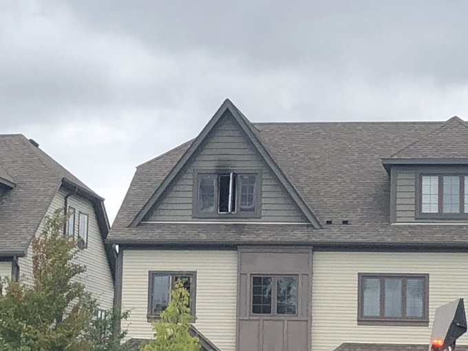 Smoke and fire damage could be seen in an upstairs window following a bedroom fire in Guelph on Wednesday.