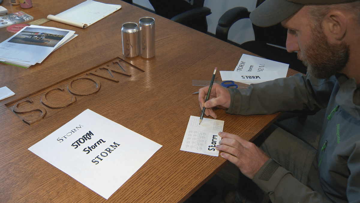 Guy Gautreau, a project manager at Belliveau Orchard, works on the label for a cider the company is creating after Hurricane Dorian made landfall in the Maritimes last weekend