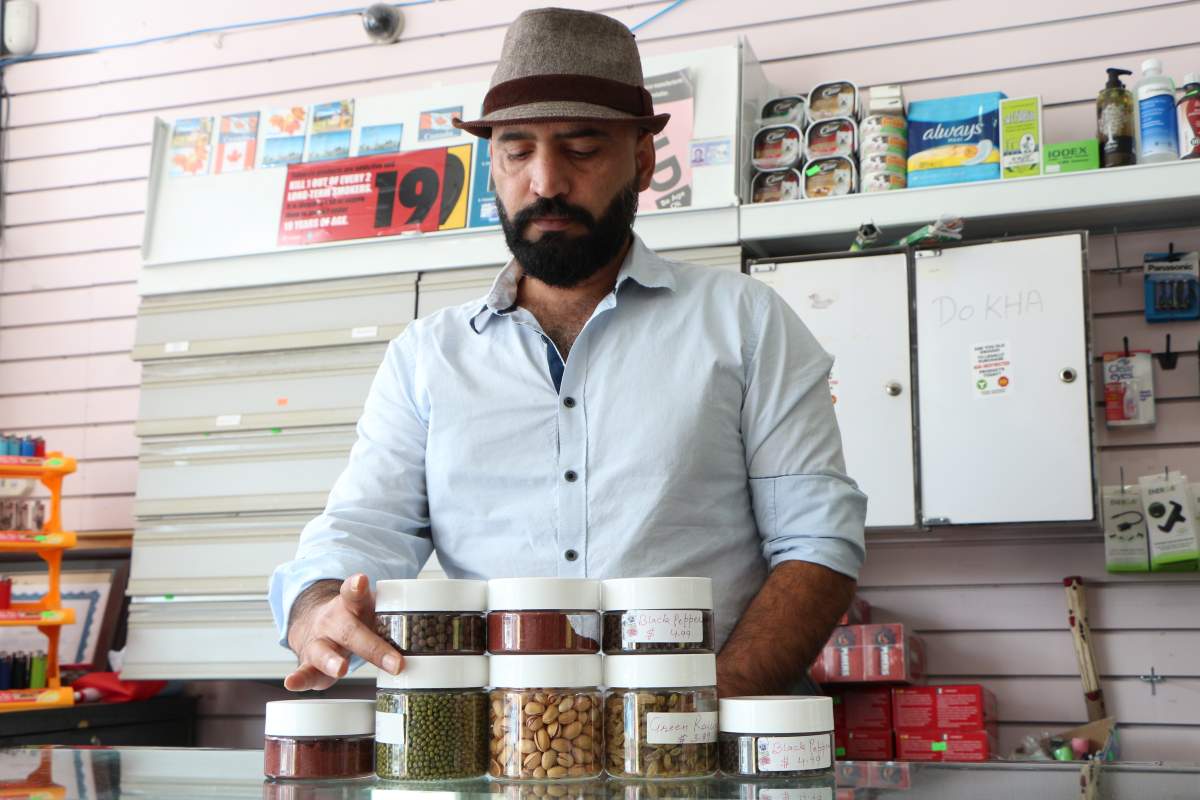 Stanikzai (pictured above) says his imported spices are his business’ main attraction. Now, he says he has trouble selling them.